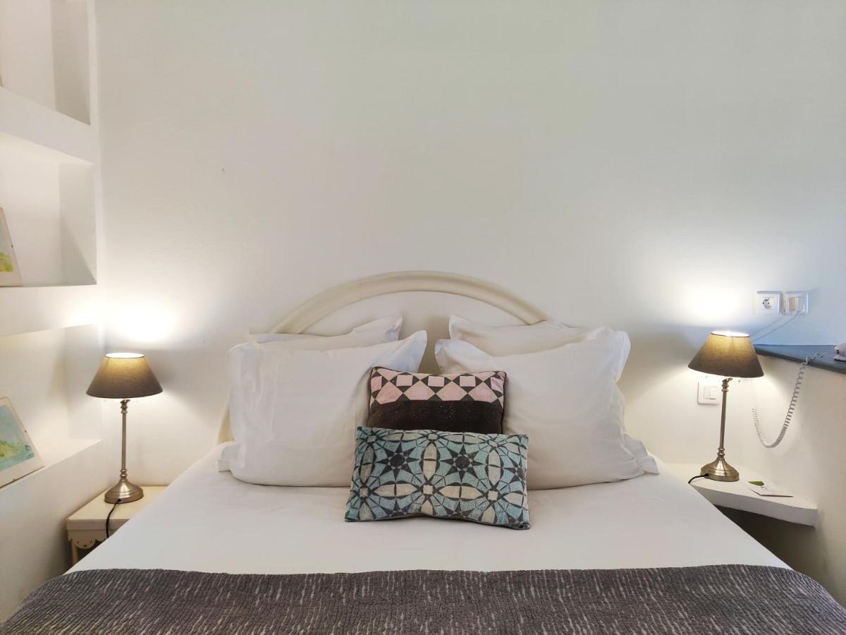 Un ou plusieurs lits dans un hébergement de l'établissement Le Roc E Fiori Hotel - Teritoria