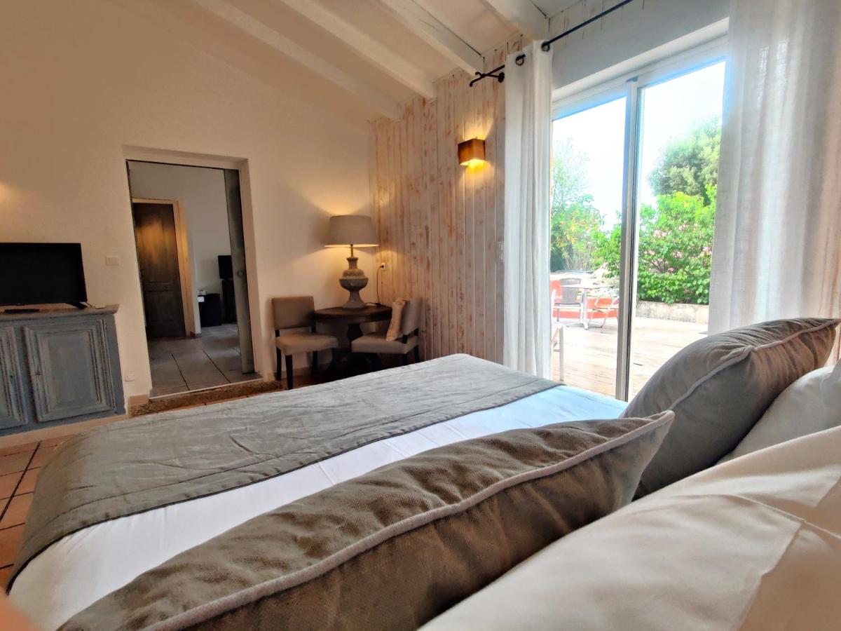 Un ou plusieurs lits dans un hébergement de l'établissement Le Roc E Fiori Hotel - Teritoria