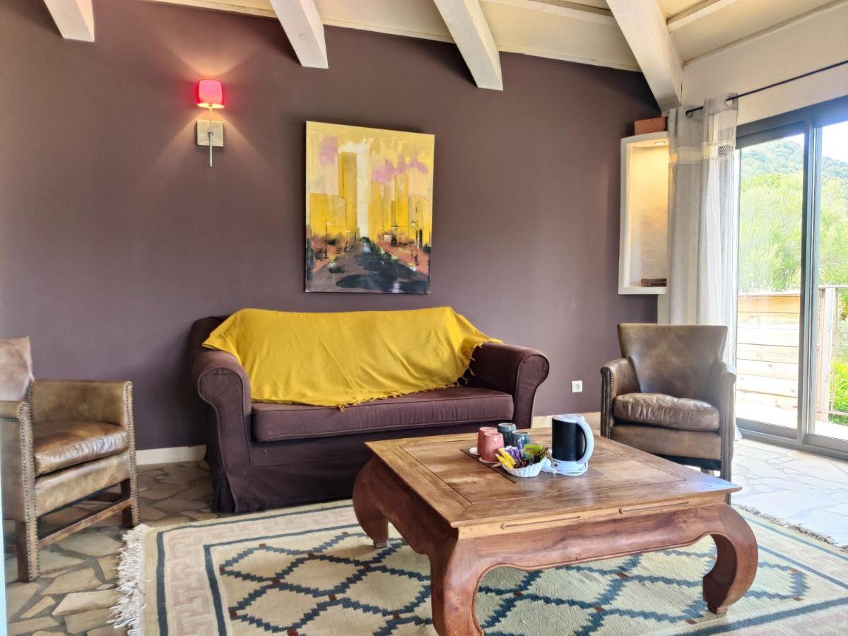 Coin salon dans l'établissement Le Roc E Fiori Hotel - Teritoria