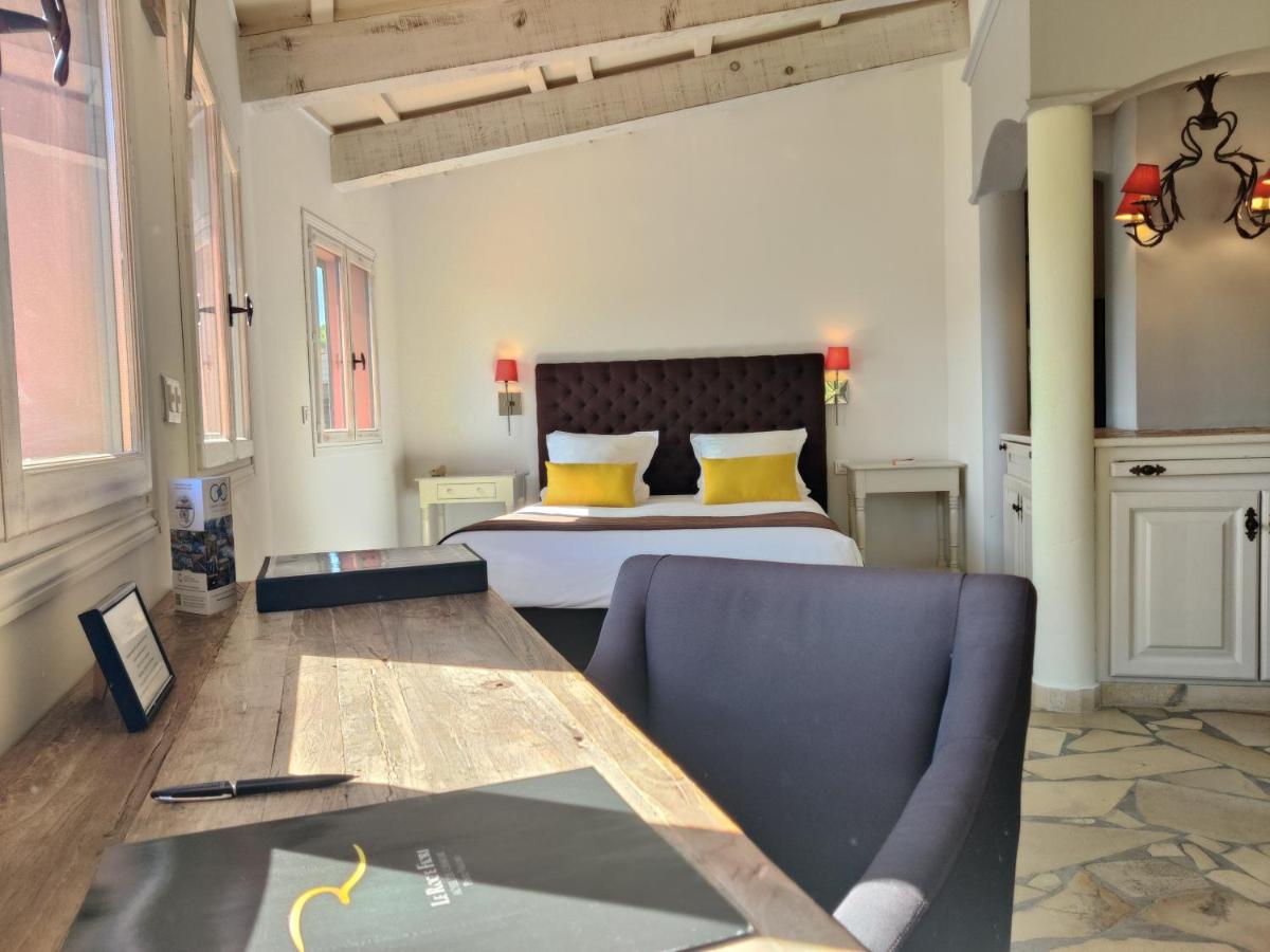 Un ou plusieurs lits dans un hébergement de l'établissement Le Roc E Fiori Hotel - Teritoria
