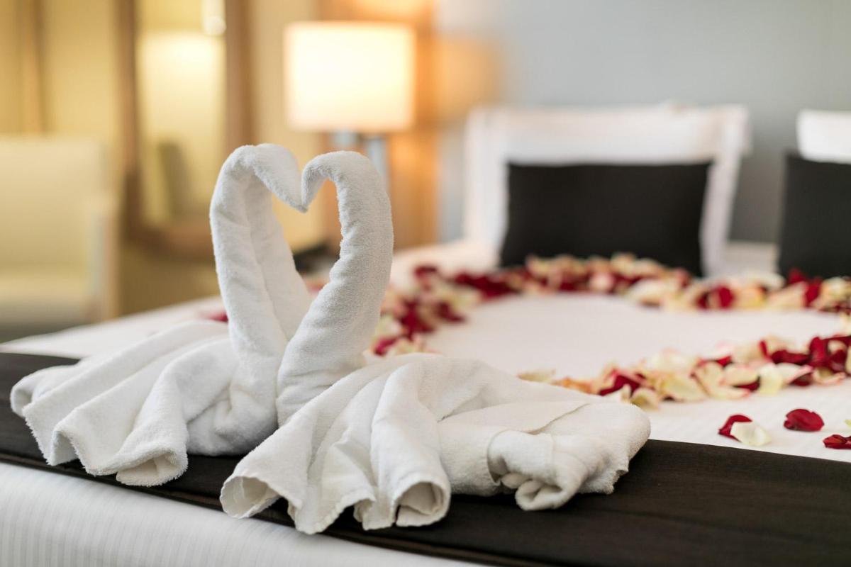 Un ou plusieurs lits dans un hébergement de l'établissement 7Hotel&Spa