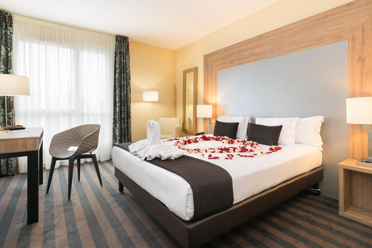 Un ou plusieurs lits dans un hébergement de l'établissement 7Hotel&Spa