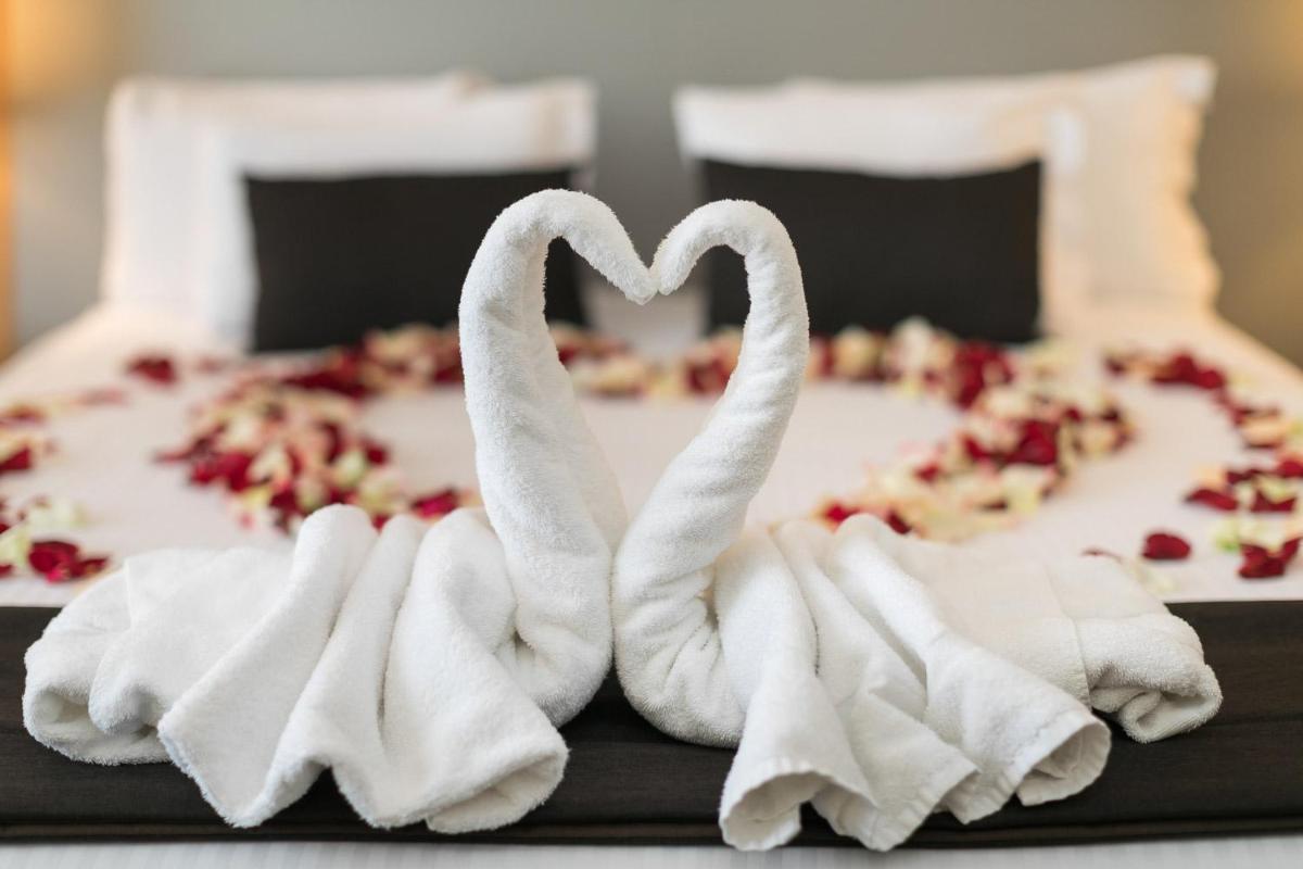 Un ou plusieurs lits dans un hébergement de l'établissement 7Hotel&Spa