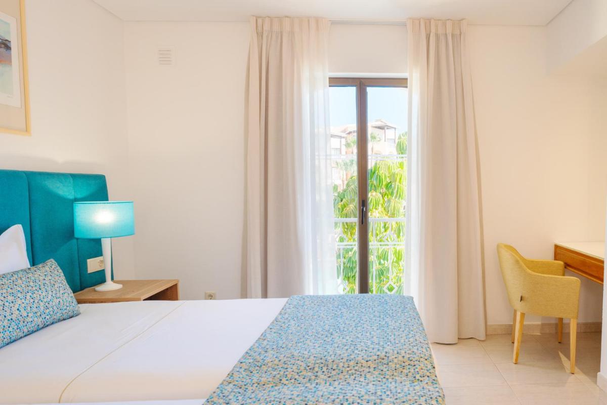 Uma cama ou camas num quarto em Four Seasons Vilamoura