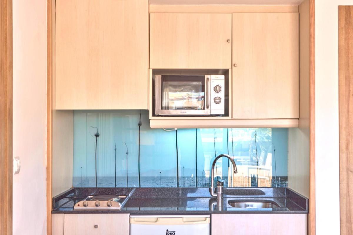 Una cocina o zona de cocina en Zafiro Palmanova