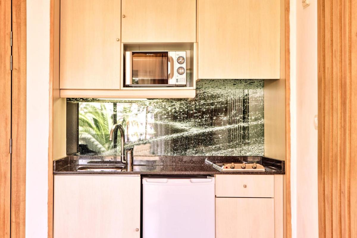 Una cocina o zona de cocina en Zafiro Palmanova
