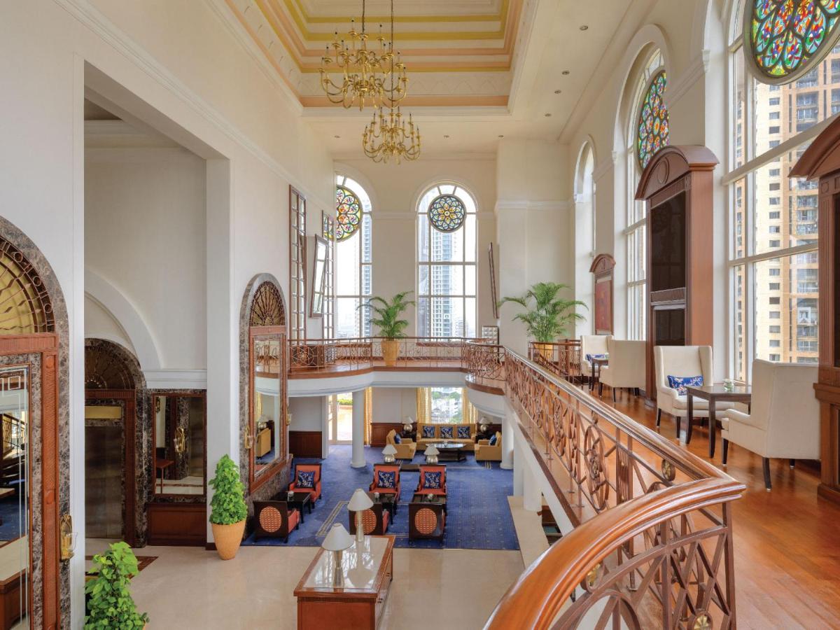 a large lobby with a staircase and windows at ITC Grand Central, a Luxury Collection Hotel, Mumbai in Mumbai