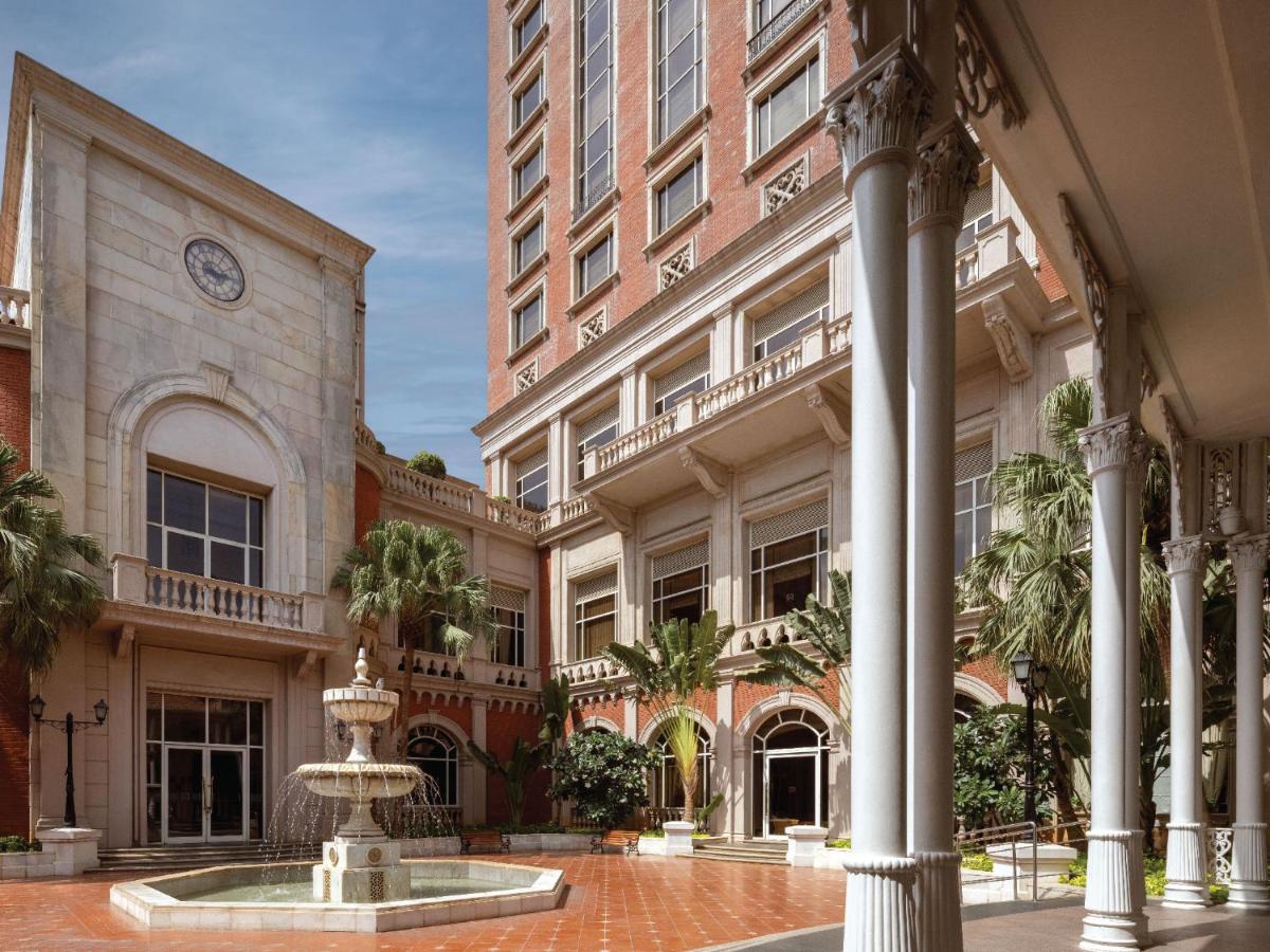 a building with a fountain in front of a building at ITC Grand Central, a Luxury Collection Hotel, Mumbai in Mumbai