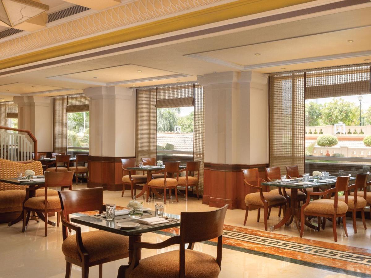 a dining room with tables and chairs and windows at ITC Grand Central, a Luxury Collection Hotel, Mumbai in Mumbai