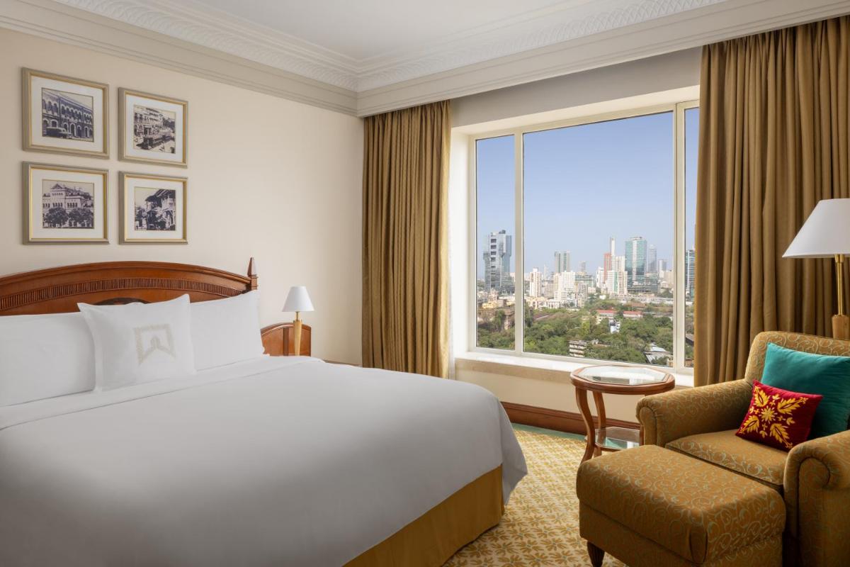 a hotel room with a bed and a large window at ITC Grand Central, a Luxury Collection Hotel, Mumbai in Mumbai