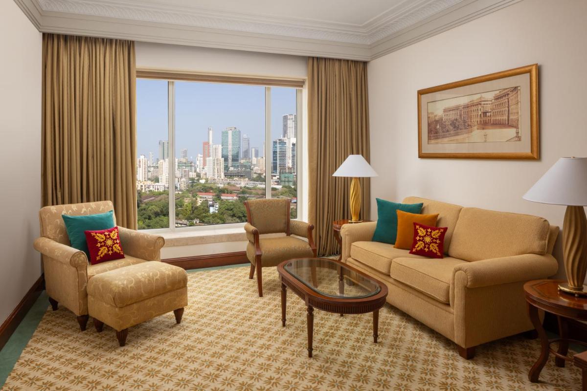 a living room with a couch and chairs and a large window at ITC Grand Central, a Luxury Collection Hotel, Mumbai in Mumbai