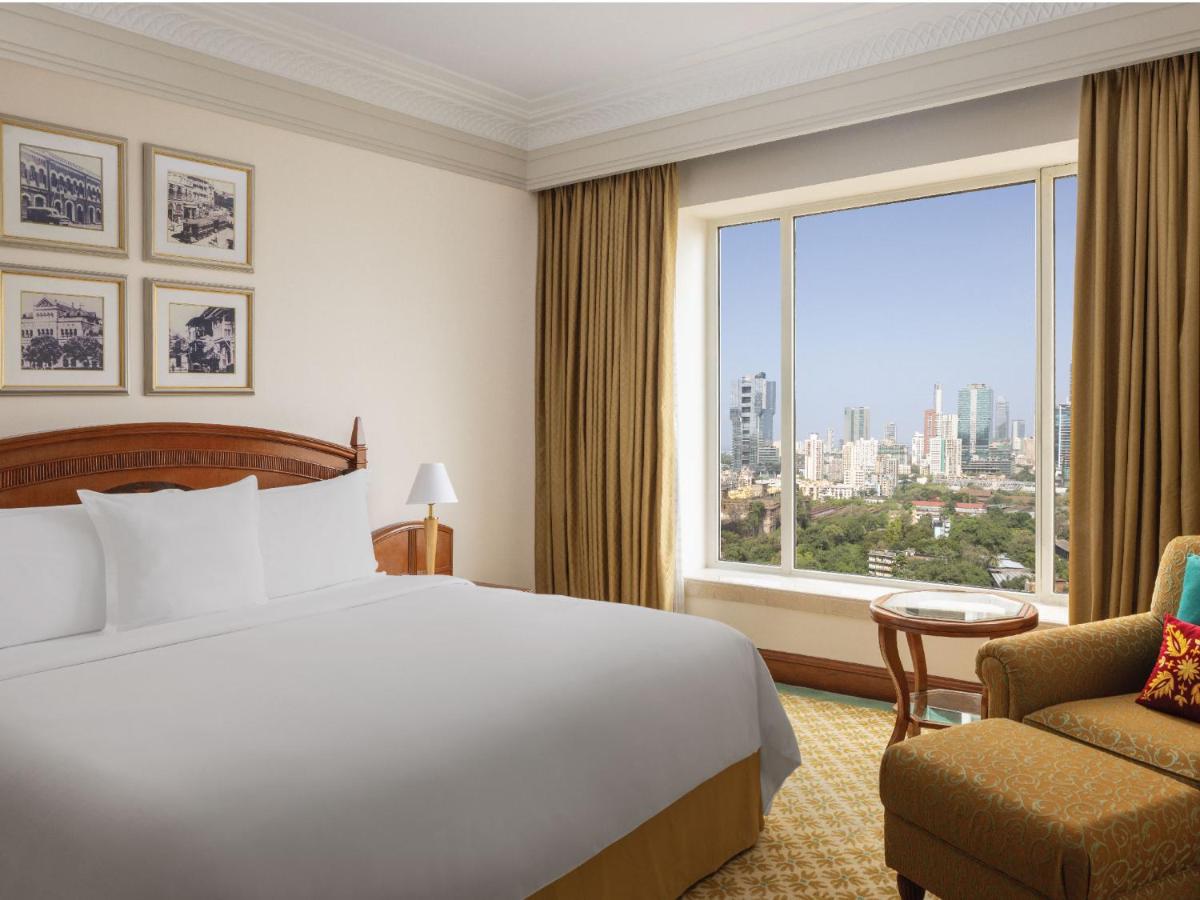 a hotel room with a bed and a large window at ITC Grand Central, a Luxury Collection Hotel, Mumbai in Mumbai