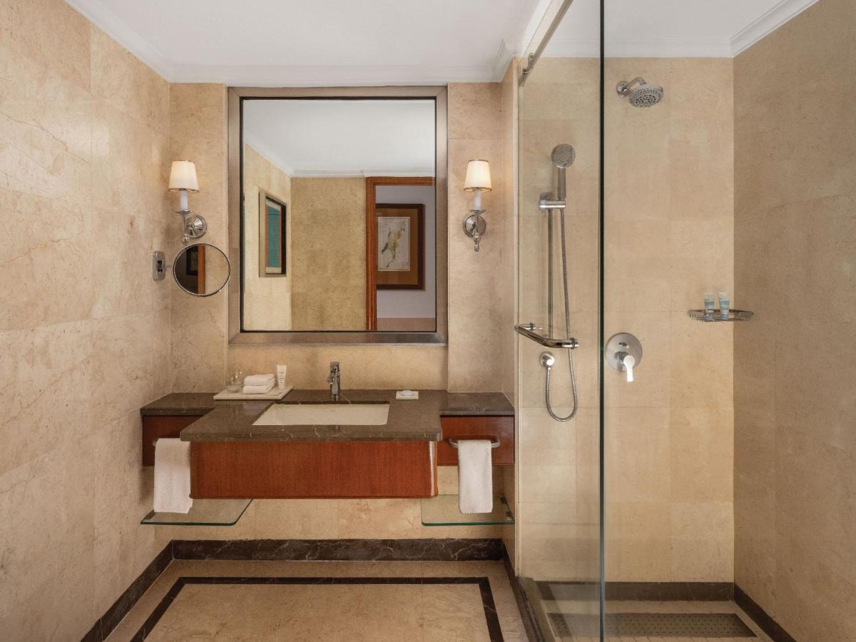 a bathroom with a sink and a shower at ITC Grand Central, a Luxury Collection Hotel, Mumbai in Mumbai