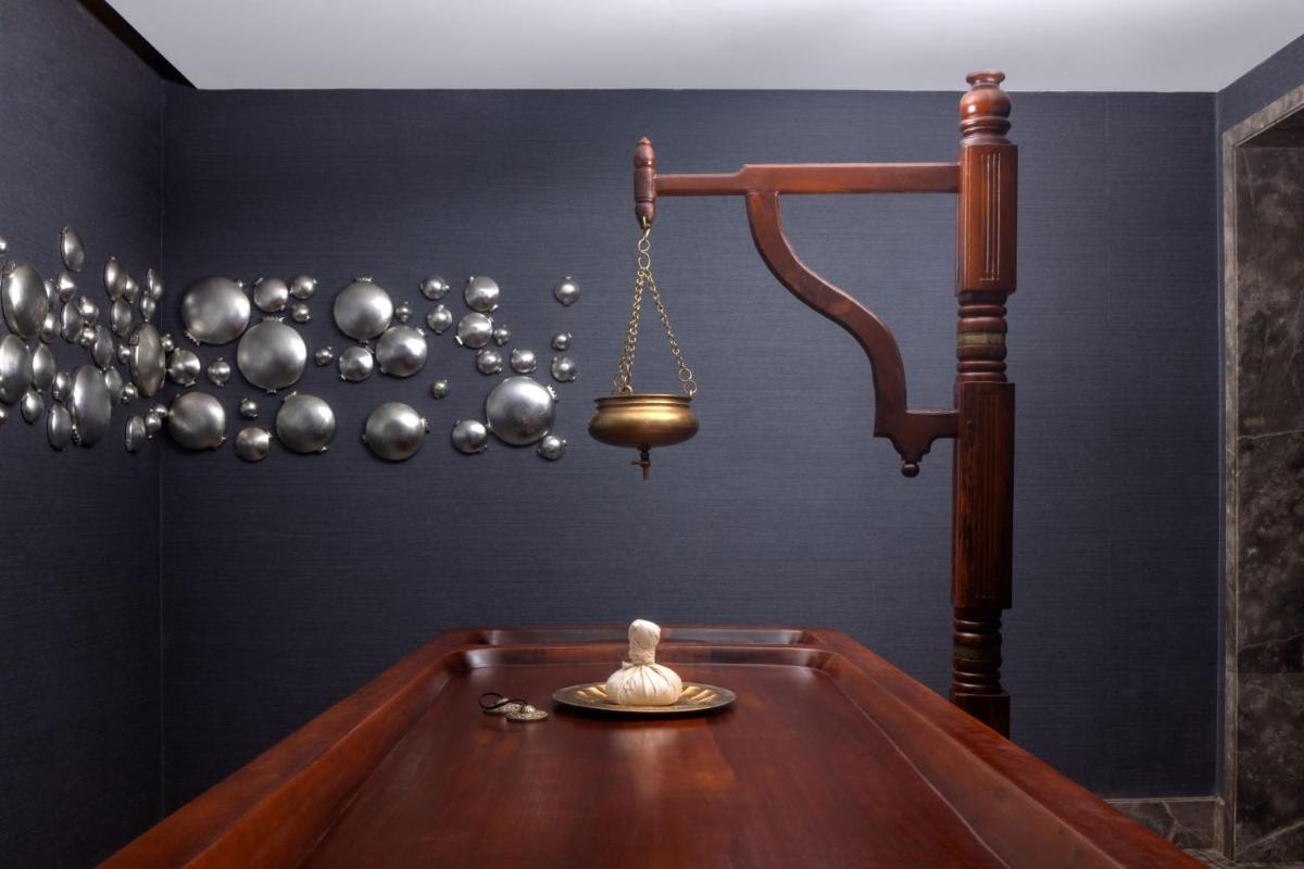 a room with a pool table with a gavel at ITC Windsor, a Luxury Collection Hotel, Bengaluru in Bengaluru a room with a pool table with a gavel at ITC Windsor, a Luxury Collection Hotel, Bengaluru in Bengaluru