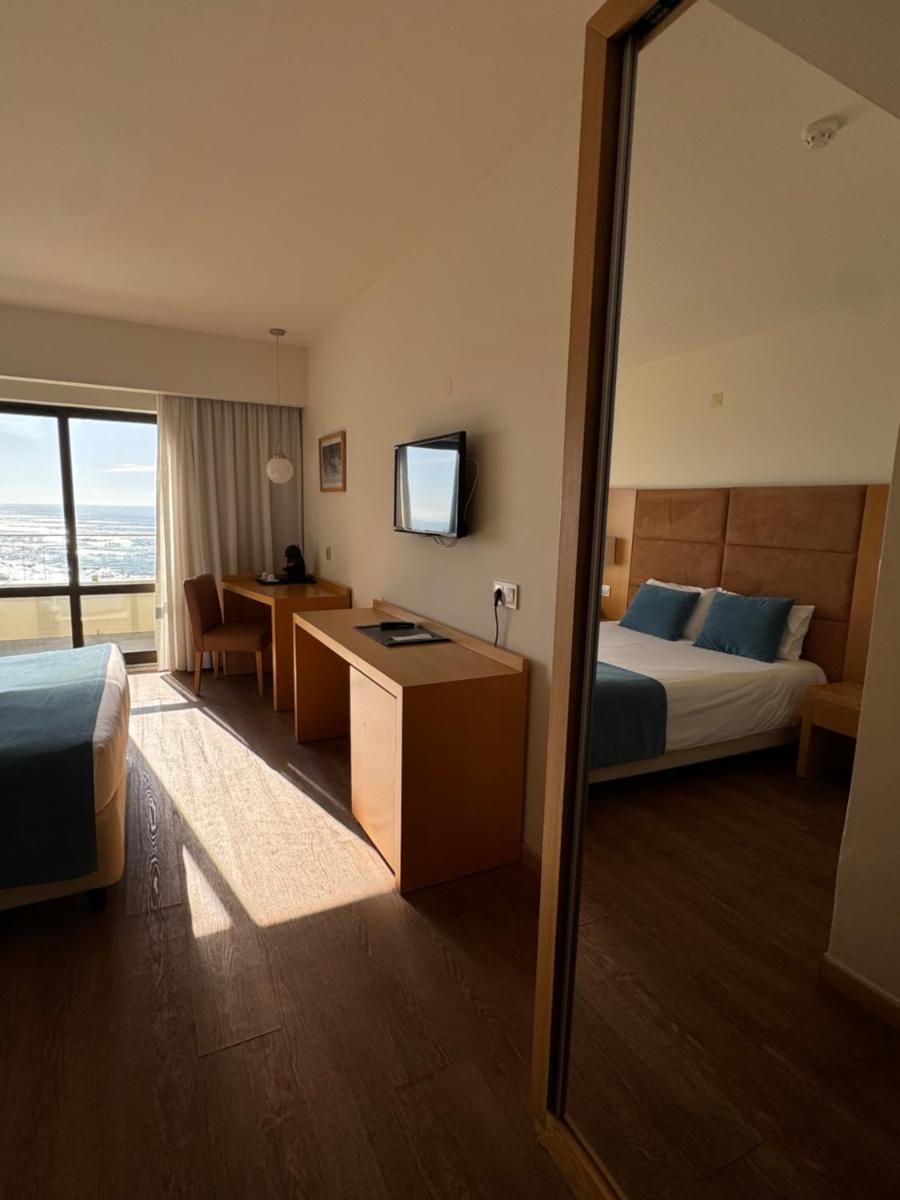 Uma cama ou camas num quarto em Hotel Atlantida Sol