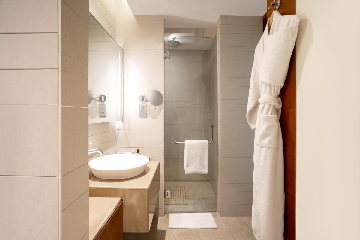 a bathroom with a sink and a toilet at Hyatt Pune in Pune