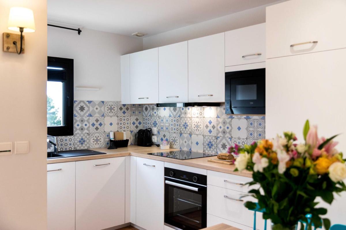 Cuisine ou kitchenette dans l'établissement La Résidence du Bailli