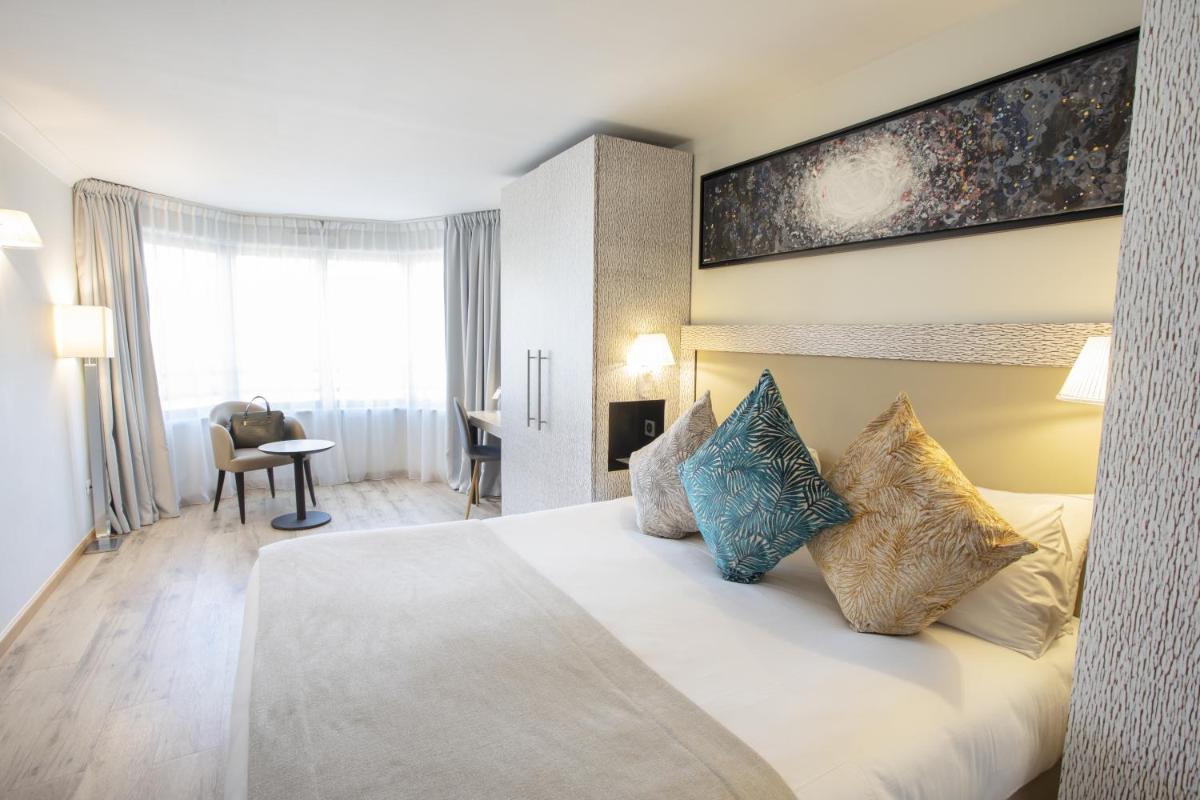 Un ou plusieurs lits dans un hébergement de l'établissement Eden Hotel & Spa