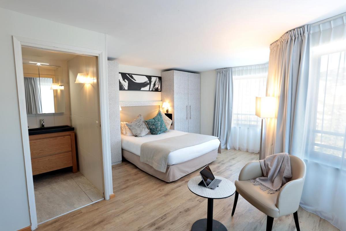 Un ou plusieurs lits dans un hébergement de l'établissement Eden Hotel & Spa