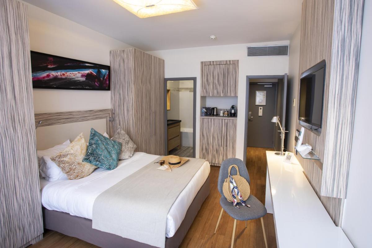 Un ou plusieurs lits dans un hébergement de l'établissement Eden Hotel & Spa