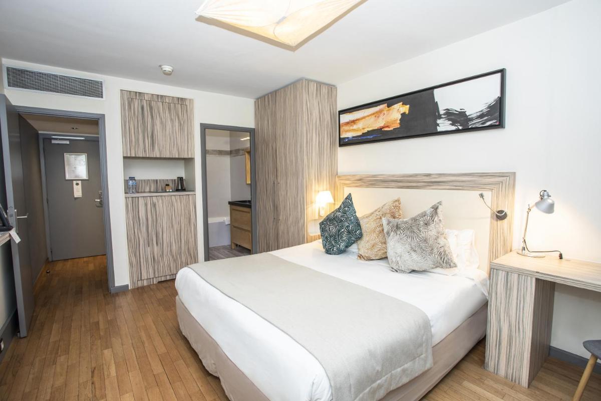 Un ou plusieurs lits dans un hébergement de l'établissement Eden Hotel & Spa