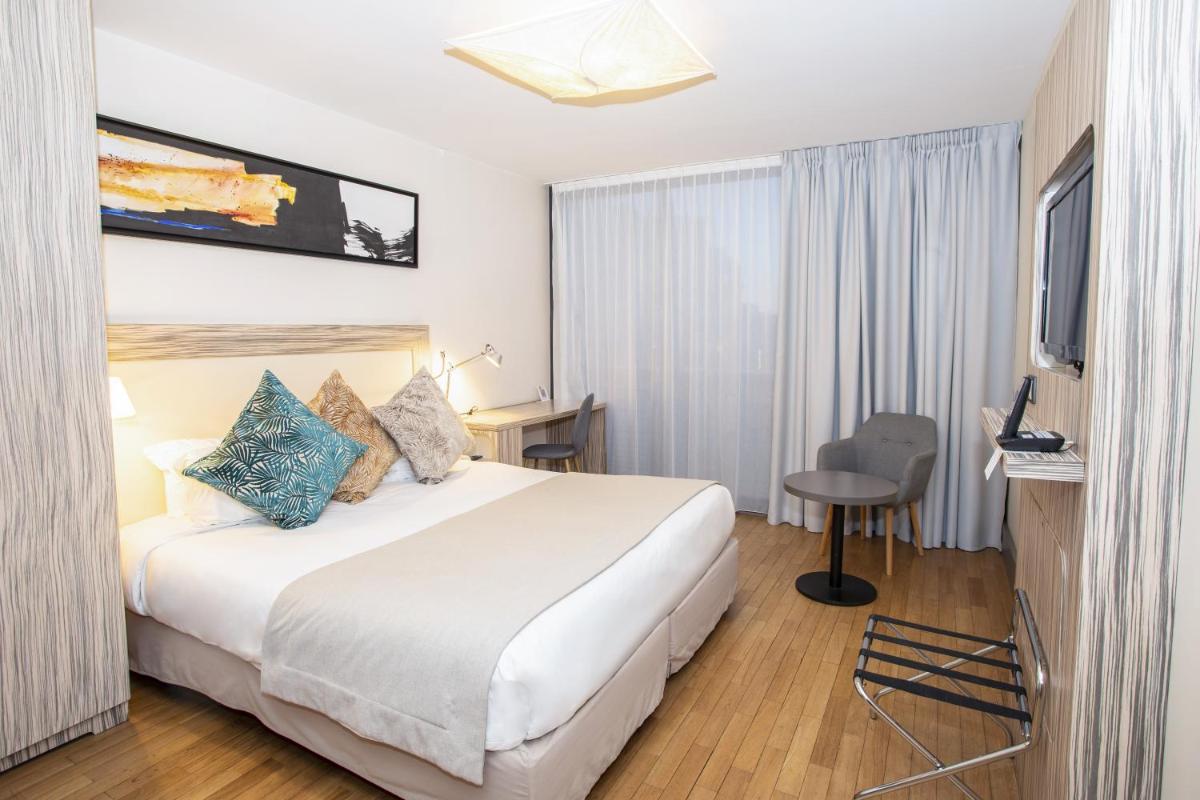 Un ou plusieurs lits dans un hébergement de l'établissement Eden Hotel & Spa