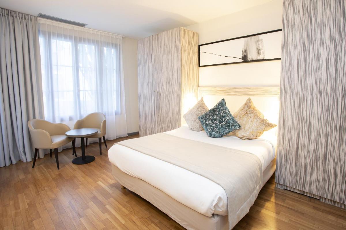Un ou plusieurs lits dans un hébergement de l'établissement Eden Hotel & Spa