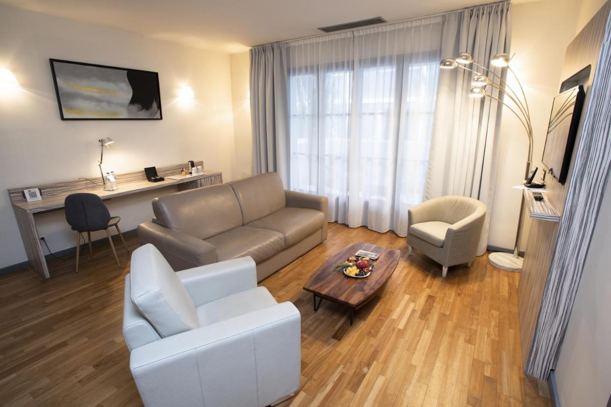 Coin salon dans l'établissement Eden Hotel & Spa