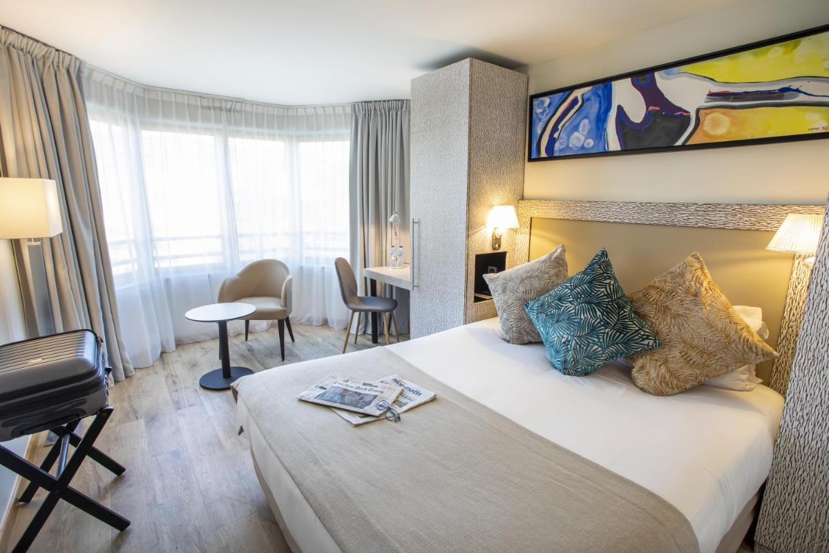 Un ou plusieurs lits dans un hébergement de l'établissement Eden Hotel & Spa