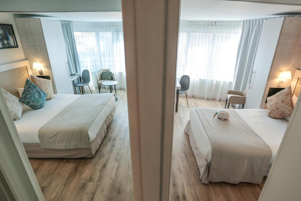 Un ou plusieurs lits dans un hébergement de l'établissement Eden Hotel & Spa