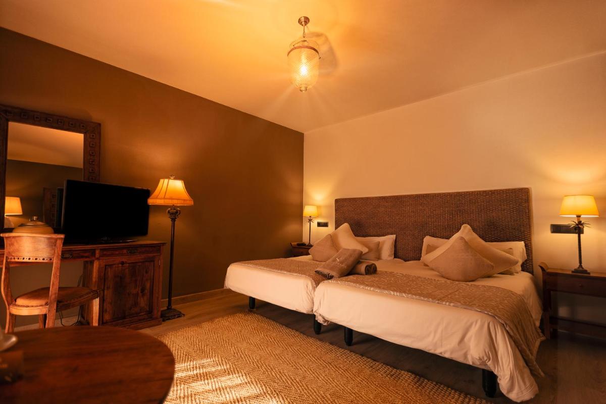 Cama o camas de una habitación en SWISS MORAIRA HOTEL & SPA - Adults only