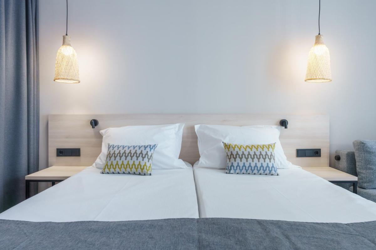 Cama o camas de una habitación en DWO Les Palmeres