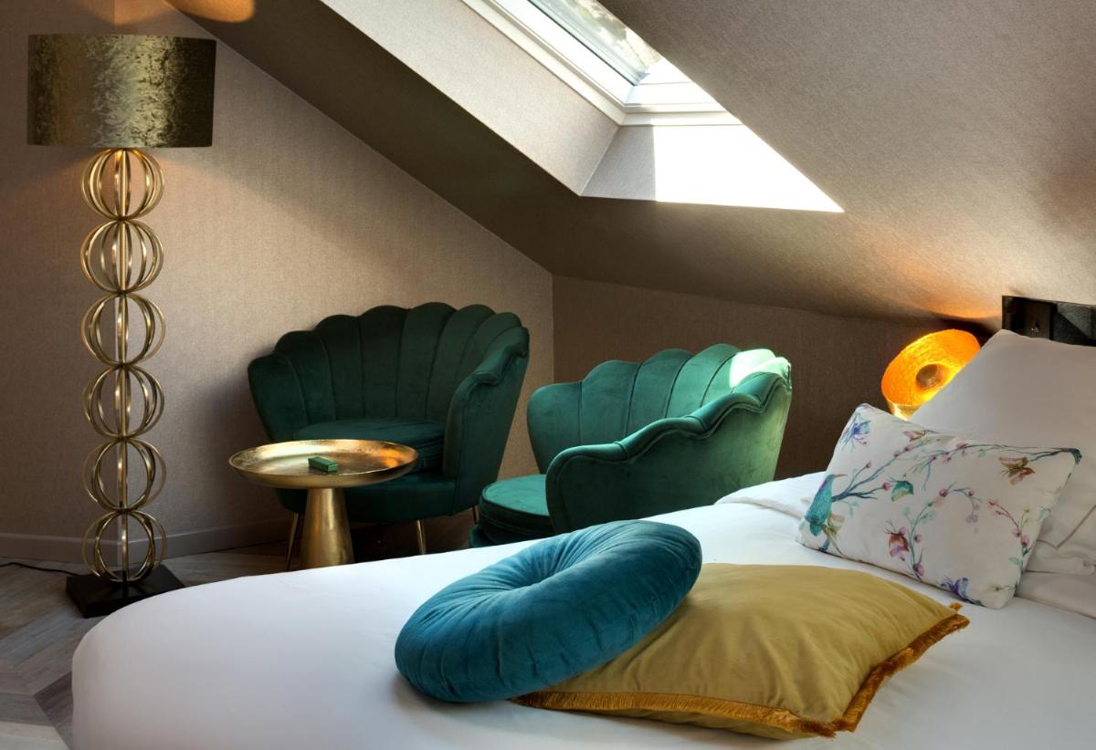 Un ou plusieurs lits dans un hébergement de l'établissement LA CHENEAUDIÈRE - Hôtel Spa - Relais & Châteaux - Restaurant étoilé