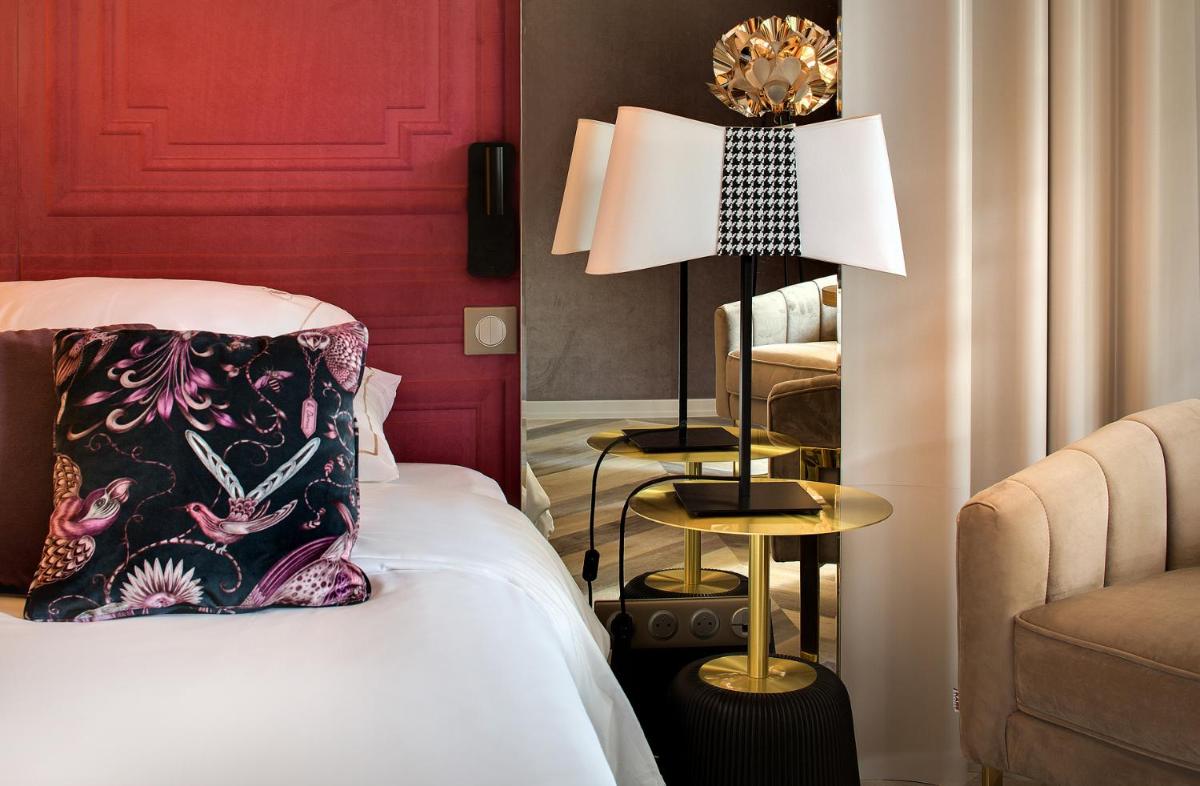 Un ou plusieurs lits dans un hébergement de l'établissement LA CHENEAUDIÈRE - Hôtel Spa - Relais & Châteaux - Restaurant étoilé