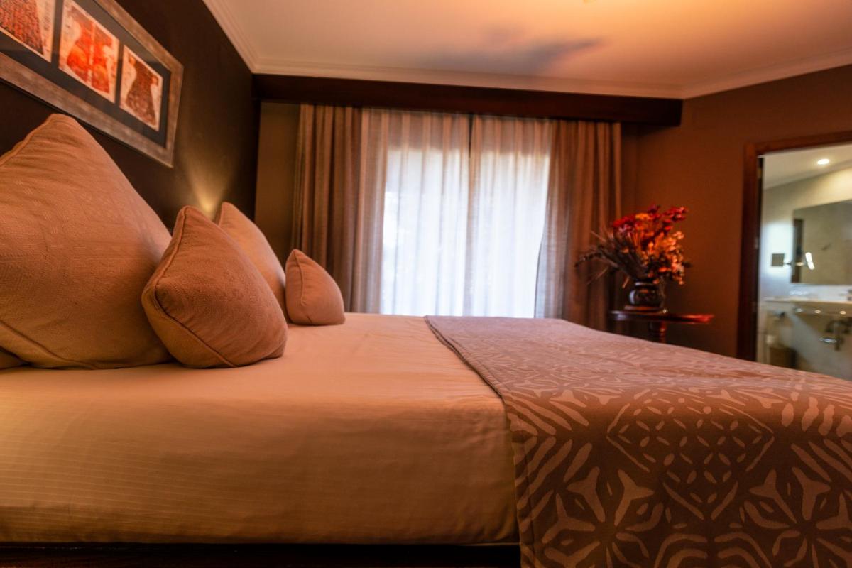 Cama o camas de una habitación en SWISS MORAIRA HOTEL & SPA - Adults only