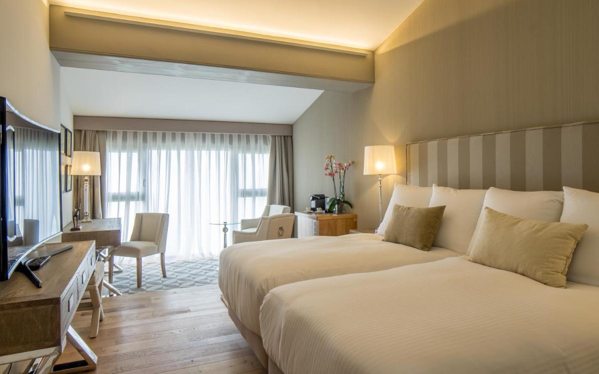 Cama o camas de una habitación en Puebloastur Eco Resort Hotel & Spa