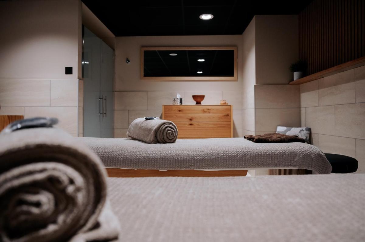 Un ou plusieurs lits dans un hébergement de l'établissement Keystone Hôtel & Spa