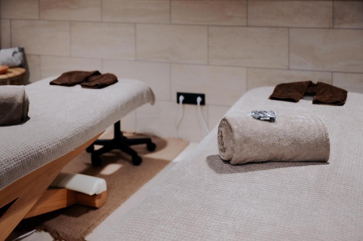 Un ou plusieurs lits dans un hébergement de l'établissement Keystone Hôtel & Spa