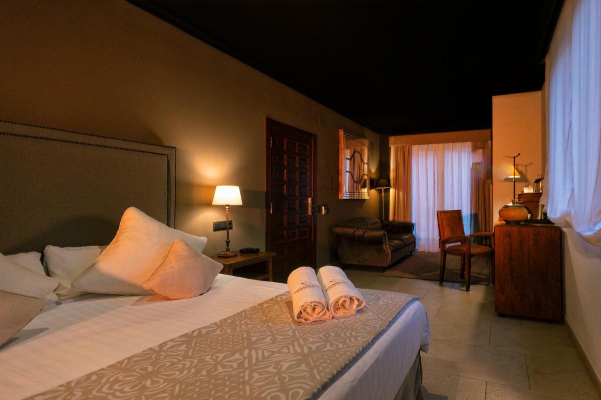 Cama o camas de una habitación en SWISS MORAIRA HOTEL & SPA - Adults only