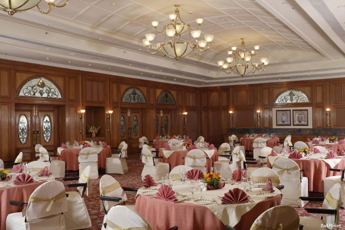 a banquet hall with tables and chairs and chandeliers at Jaypee Residency Manor in Mussoorie +51 photos
