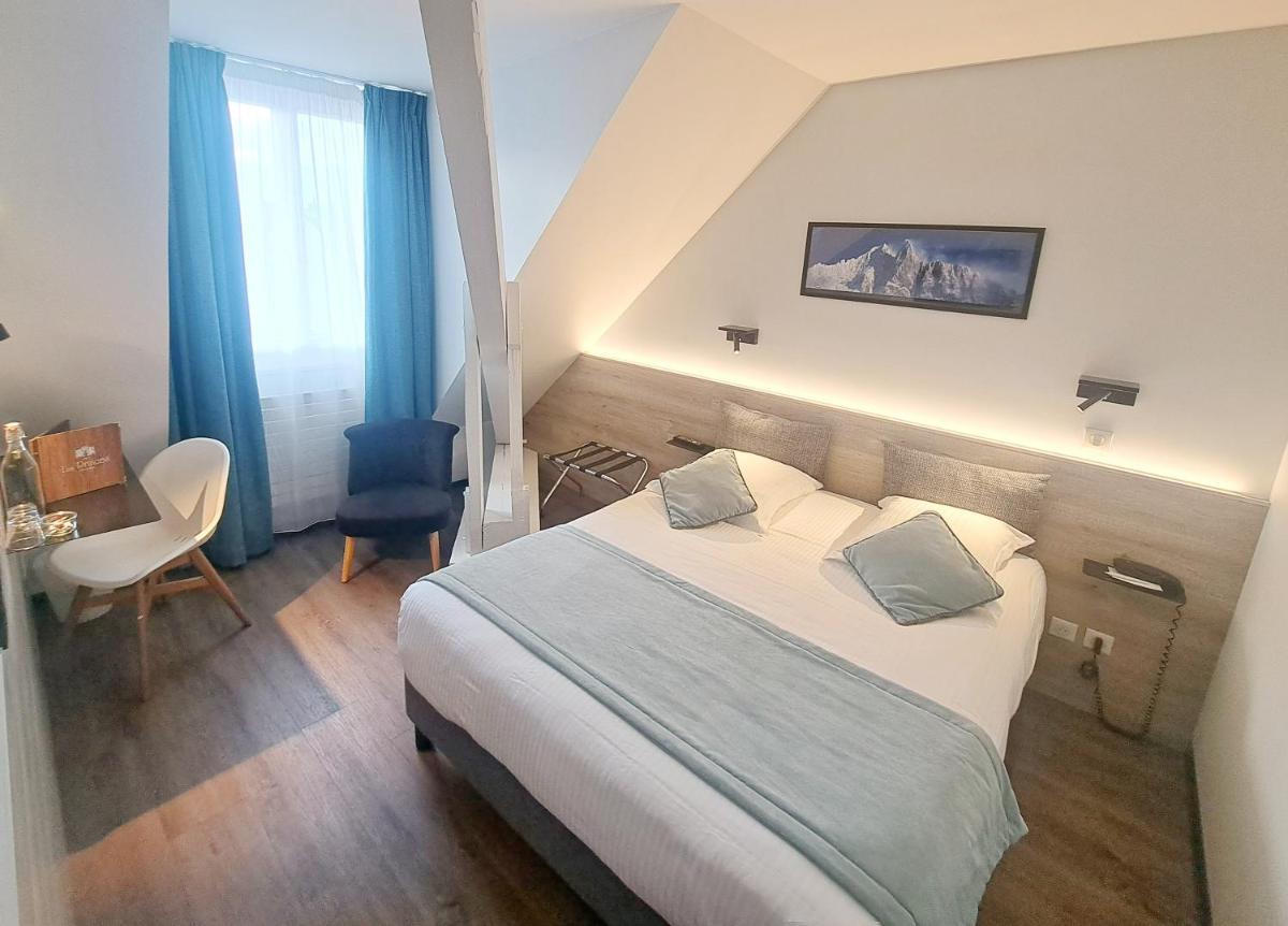 Un ou plusieurs lits dans un hébergement de l'établissement Hôtel des Princes, Chambéry Centre
