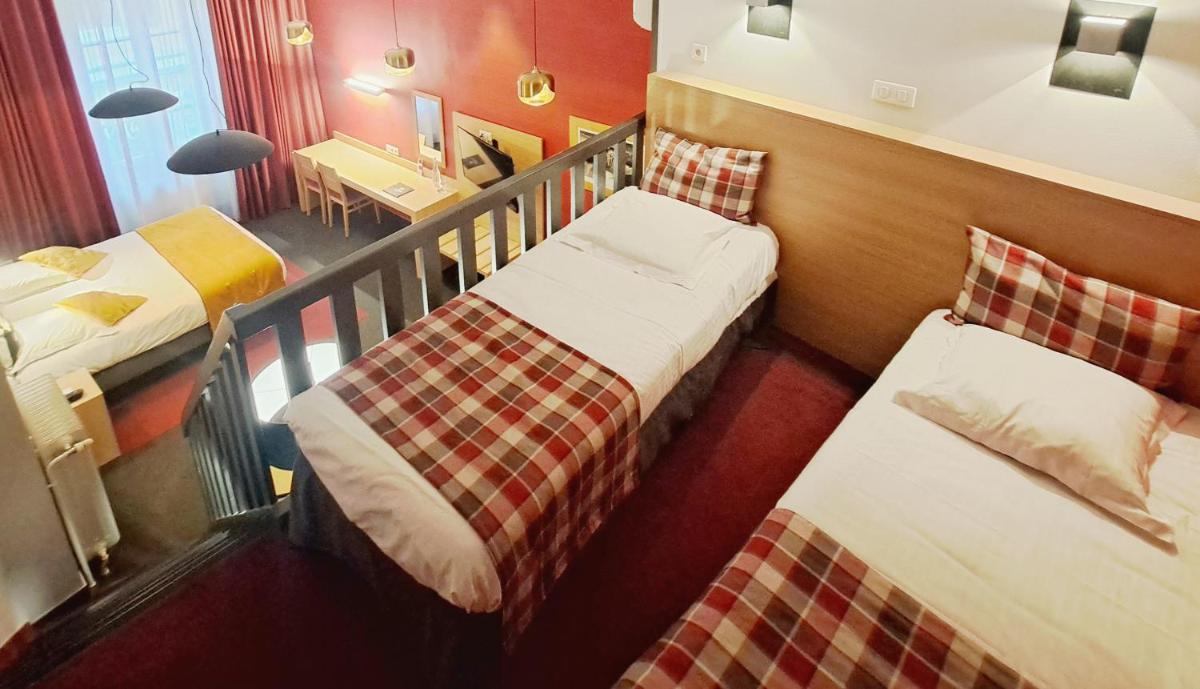 Un ou plusieurs lits dans un hébergement de l'établissement Hôtel des Princes, Chambéry Centre