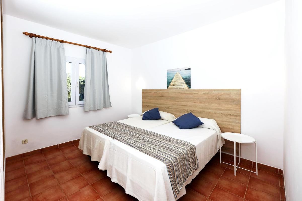 Cama o camas de una habitación en Hotel Club Es Talaial