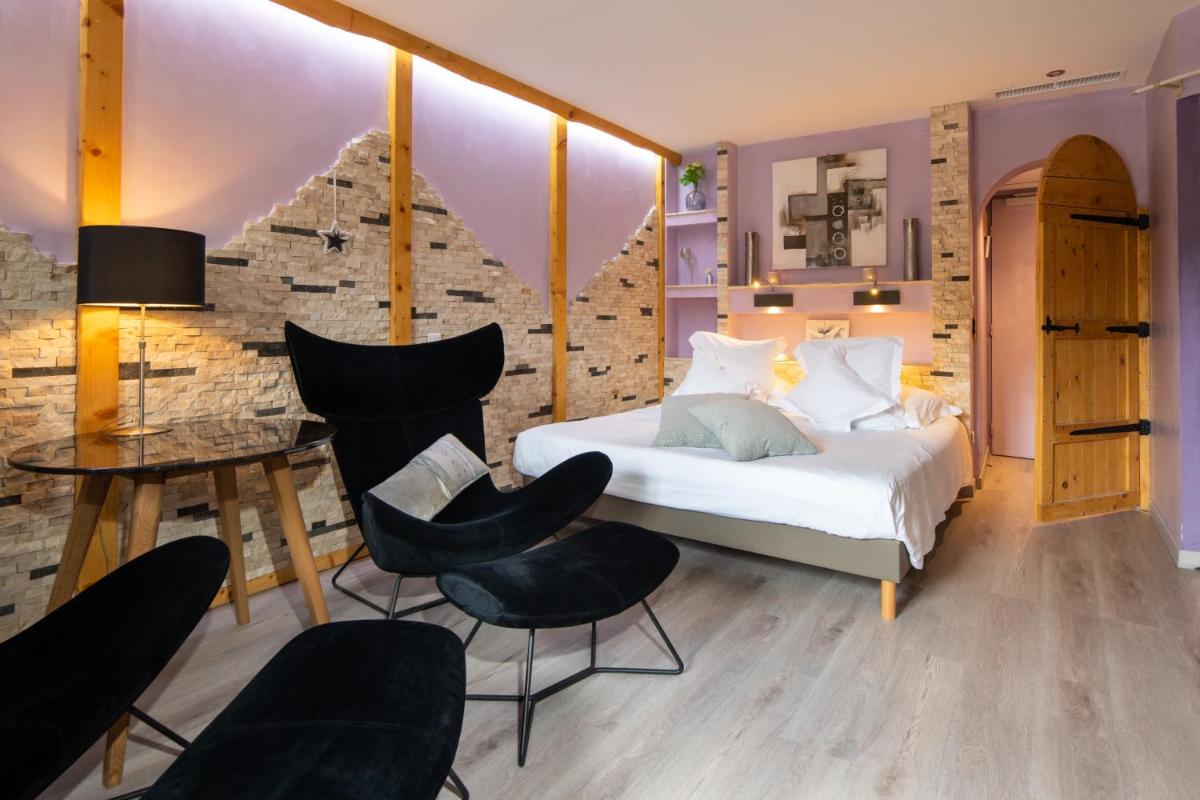 Un ou plusieurs lits dans un hébergement de l'établissement Domaine du Haut Jardin Hôtel & Chalets Spa Privé
