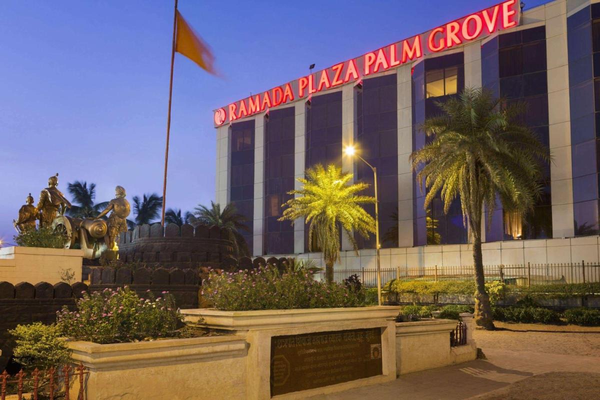 a building with a sign that reads drupalkakaallialli group at Ramada Plaza By Wyndham Palm Grove in Mumbai a building with a sign that reads drupalkakaallialli group at Ramada Plaza By Wyndham Palm Grove in Mumbai