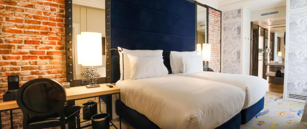 Cama o camas de una habitación en Pestana Collection Plaza Mayor