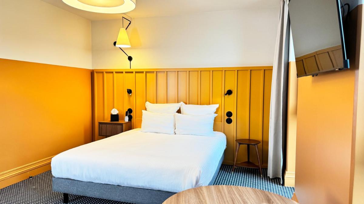 Un ou plusieurs lits dans un hébergement de l'établissement Kyriad Prestige Compiègne Hotel & Spa
