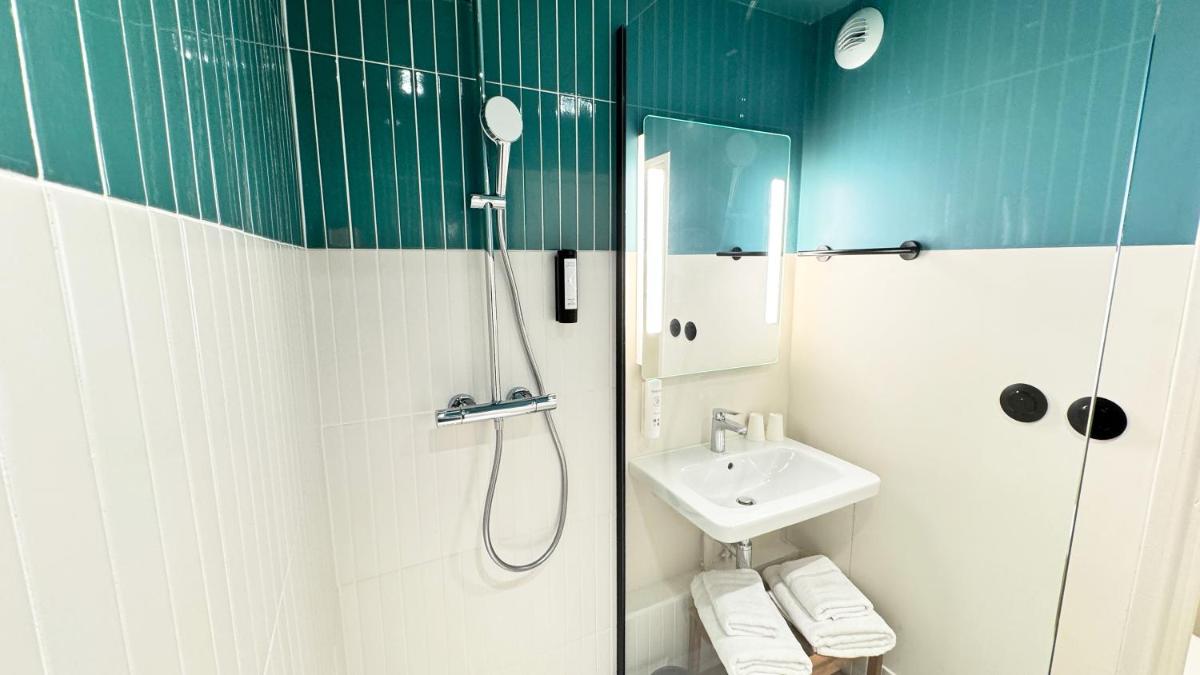 Salle de bains dans l'établissement Kyriad Prestige Compiègne Hotel & Spa
