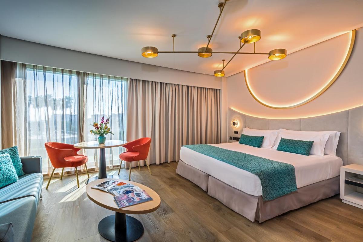 Cama o camas de una habitación en Barceló Sevilla Renacimiento