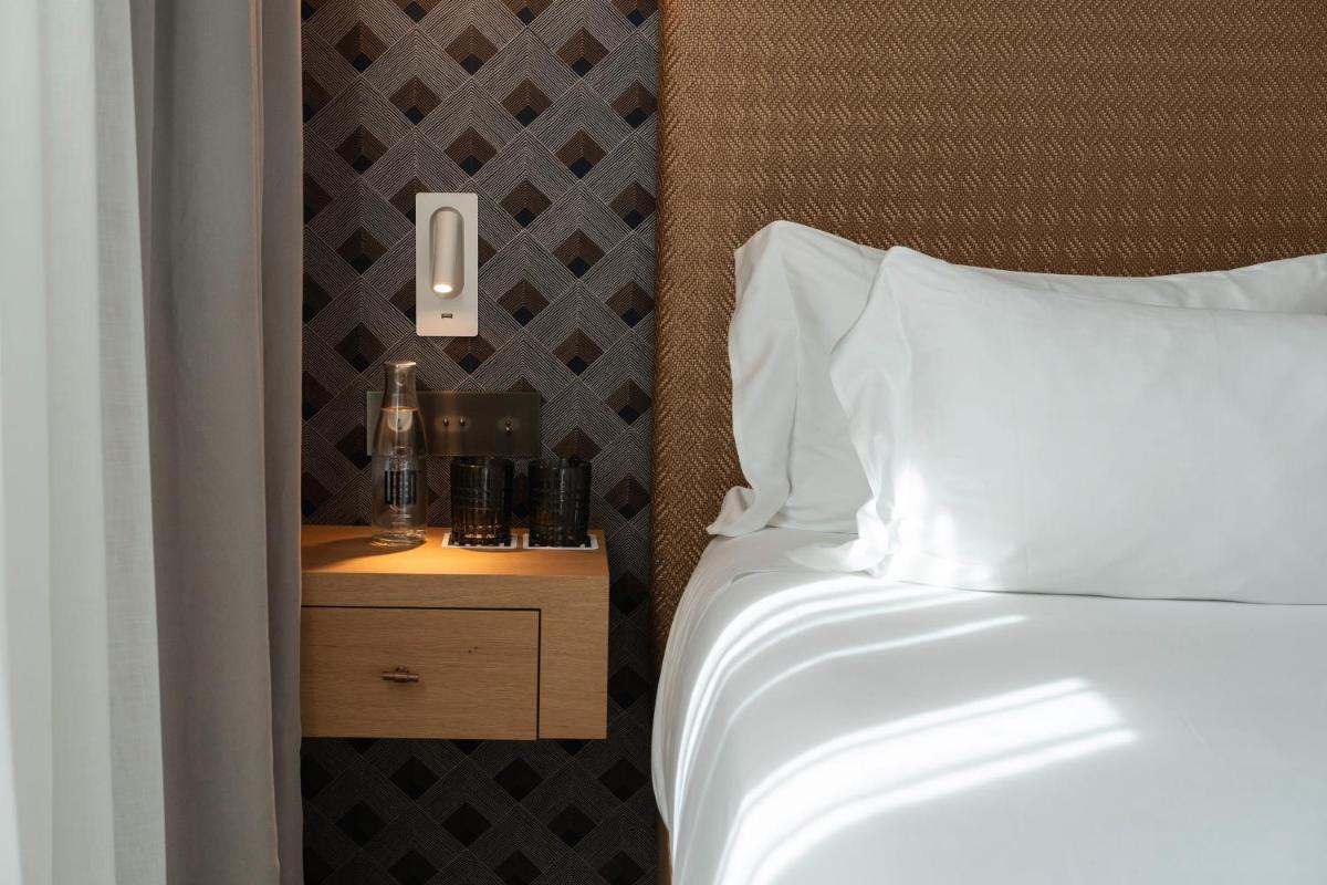 Cama o camas de una habitación en UMusic Hotel Madrid